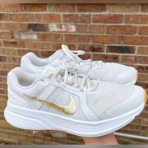 White Nikes gold